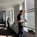 Professional window cleaner in an office in Manhattan, New York