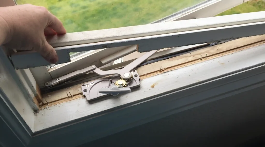 Casement window crank operator exposed during replacement or repair