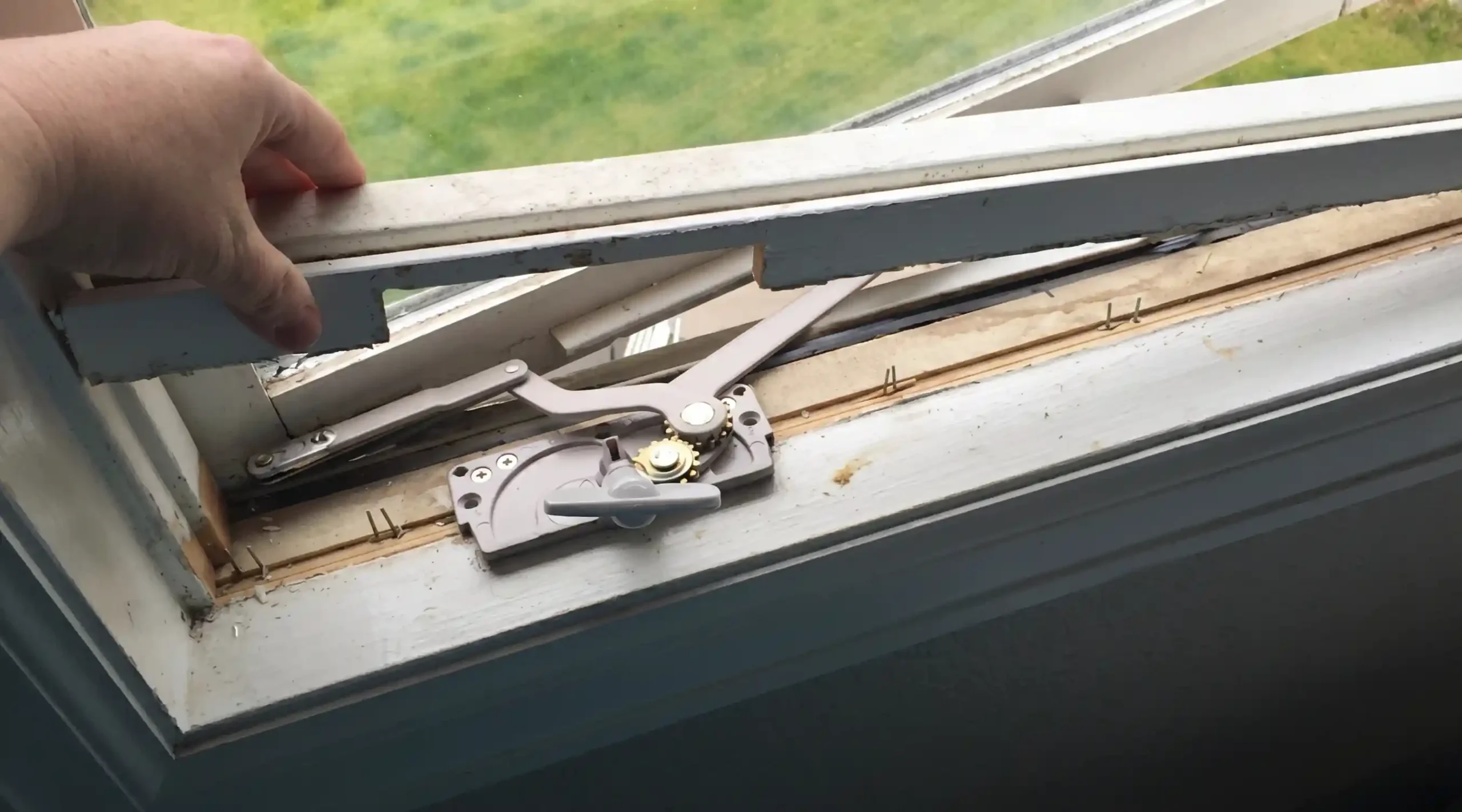 Casement window crank operator exposed during replacement or repair