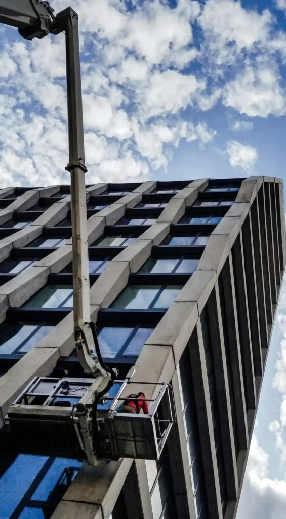 Aerial lift used for commercial window cleaning on a New York building facade