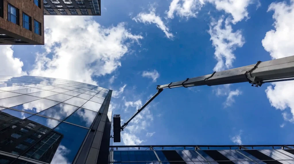 Boom lift access used for commercial window washing on glass buildings